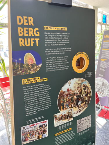 Zu sehen ist ein Teil der Ausstellung, der sich mit Rassismus und Kolonialismus im Rahmen des Erlanger Berg bschäftigt